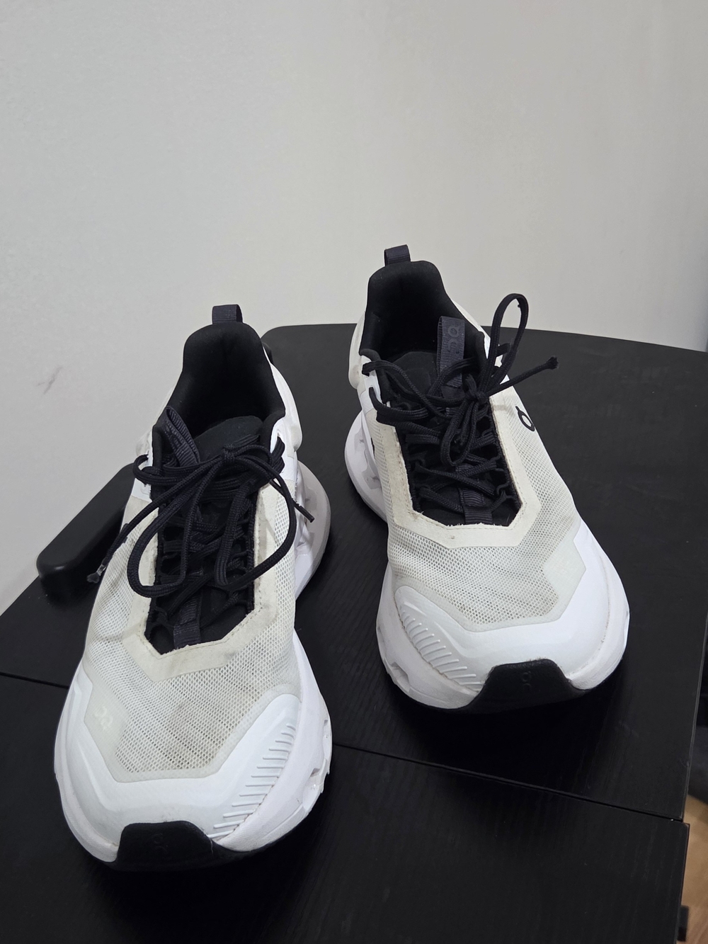 The On Cloudnova X sneakers in the black and white colorway